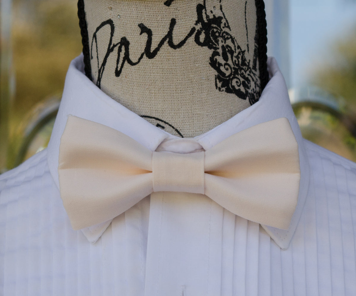 pale pink bow tie and suspenders